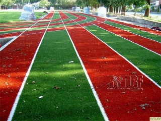 Artificial turf running tracks